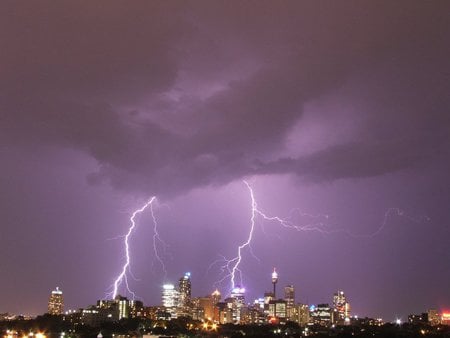 City under siege - night, city, lightning, purple sky, lightening, lights