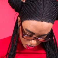 Black Female Model Sheisnovember Lashawn Mosley Posing With Braided Hair And Glasses