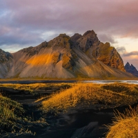 Black sand dunes, jagged peaks, and a crazy sunset at Stokksnes, Iceland