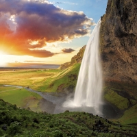 A waterfall and sunset