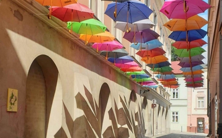 Street in Tarnow, Poland - street, umbrellas, Poland, houses