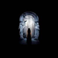 from darkness she comes