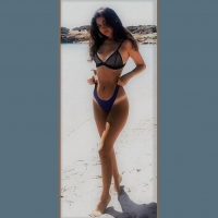 Brunette model alone on the beach