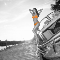 Model Posing in a Orange Bikini