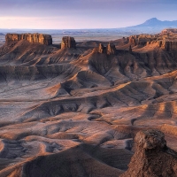 The first light of dawn illuminating the alien badlands in Central Utah