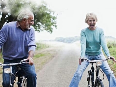 Laughing Place Bike Challenge - vibrant, vivid, blue, man, colorful, laughing, white, bright, green, woman, bicycle, challenge, couple, bold