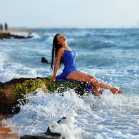 Brunette in a Blue Dress Getting Wet