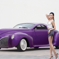 Model Posing with a Purple Hot Rod