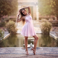 Model Posing in a Pink Dress