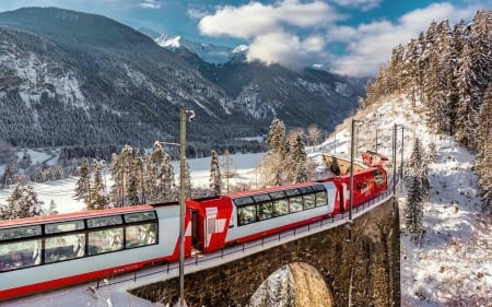 SWISS RAIL GLACIER EXPRESS PHOTO BY TOBIAS RYSER - MOUNTAINS, RED AND WHITE LIVERY, EXPRESS, VIADUCT