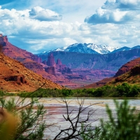 The Colorado River, Kayenta Sandstone cliffs, and La Sals of Western Utah