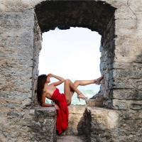 Model Posing in a Red Dress