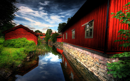 RED VILLAGE - red, still watewr, houses, pond grass, painted