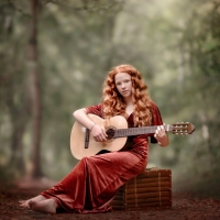 Redhead Playing a Guitar Outdoors