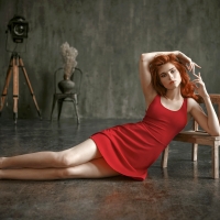 Redhead Posing in a Red Dress