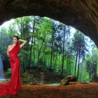 Rojo in Red Posing in a Cave