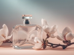 Perfume bottle and magnolia flowers