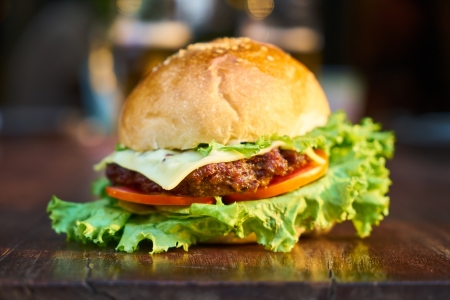 Delicious hamburger - cheese, meat, tomato, vegetable