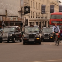 SEVERAL LONDON TAXIS ON LOWER REGENTS STREET, LONDON