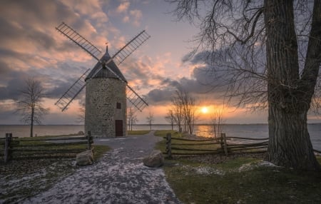 A windmill near the sea shore - Stones, Windmill, Sky, Sea, Sunset