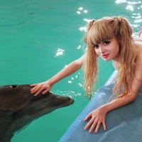 Anjelica Kenova making friends with Flipper