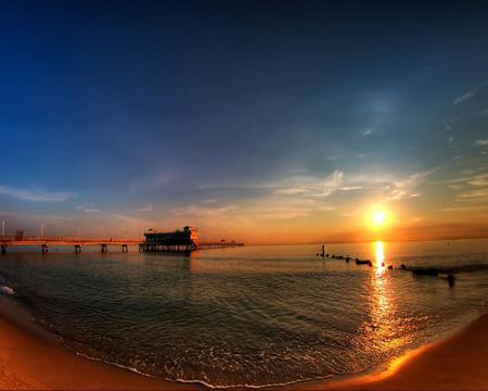 Gentle Waves - ocean, beach, sky, daylight, day, sun, water, sunset, pylons, nature, pier, reflection, dusk, sea, sand, sunrise