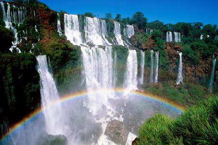 Iguazu National Park Argentina - sky, national park, rapid, water, waterfall, argentina, brazil, white, rock, rainbow, falls, daylight, day, waterfalls, natre, iguaza, bushes, nature, flowing, forces of nature, blue, colors