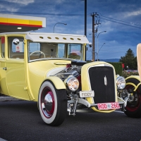 Hareniks Posing with a Yellow Hot Rod