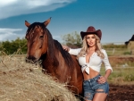 Cowgirl Posing with her Horse