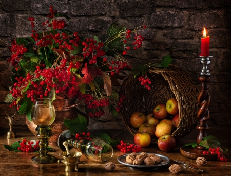 Still life with autumn - apples, basket, berries, candle, fruits