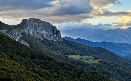 View of the Picos de Europa from Piedrasluengas, Spain - clouds, landscape, rocks, sky, trees