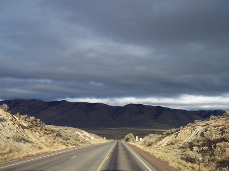 Running for the Mountains - lonely highway, into the storm again