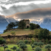 House On A Hilltop Below The Mountains