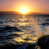 Sunset on the rocky sea