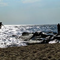 Fisherman at Sunset Beach in Cape May New Jersey