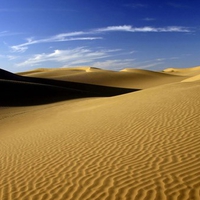 Sahara Desert, rippled sand dunes with Blue sky