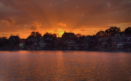 Sunny Homes - water, sunset, cottages, glow, home, homes, skies, sunny, sunrise