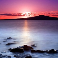 Sunrise on Auckland's North Shore with a view of Rangitoto Island