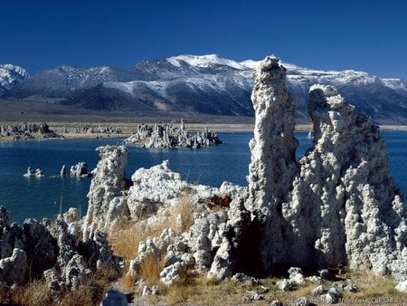 a strange place - mountains, lake, dark blue sky, snow