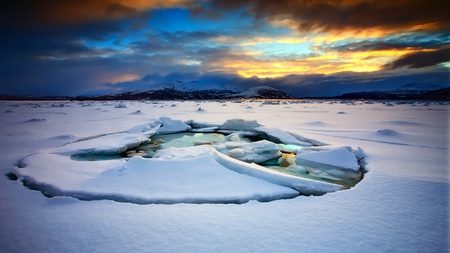 The Ice Is Breaking - clouds, colorful, ice, ray, ocean, mountain, sky