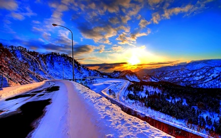 The Turning Point - sky, mountain, colorful, road, forest, clouds, snow, ray, sunrise