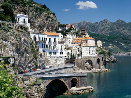 A bit of Italy - houses, tunnels, water, cars, mountains, homes, rock, sea, bridge