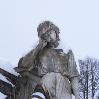 Snow covered statue