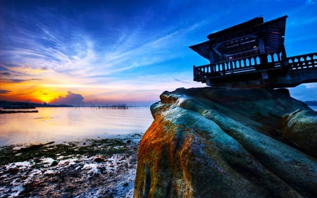 On Top Of Rock - sky, beach, shelter, clouds, blue, sunset, sea