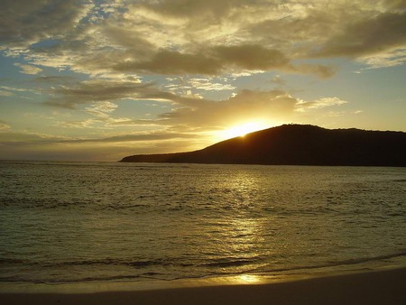 Sunset Behind An Island - clouds, sunset, water, beautiful, nice, ocean, sun, sky