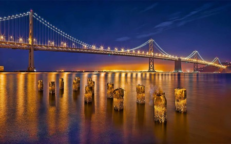 Sparkling Golden Bridge - pillars, glow, river, golden, reflection, bridge, lighting