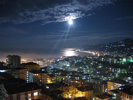 Light from above - clouds, night time, water, coast, sea, city, ocean, light, buildings, shining, houses