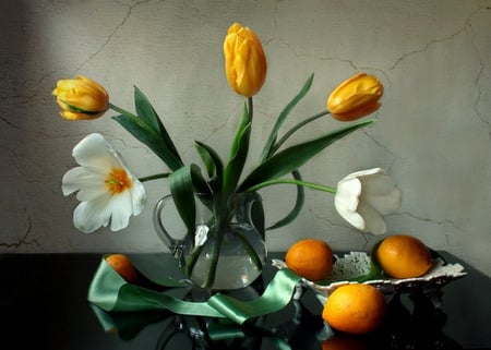 Still Yellow - yellow tulips, bowl, tulips, glass pitcher, vase, green ribbon, white tulips, table, flowers, lemons