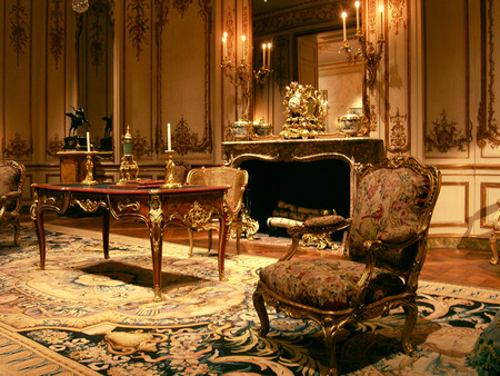 Beautiful  antiquity room - wood, brown, table, gold, statues, chair, logs, antiques, rug, fireplace, mirror, fire, lights, candles, rich, armchairs