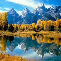 mountains in the fall by lake